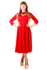 Young woman in a bright red evening dress