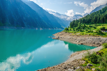 Azure lake in the background the peaks of the Alps, Austria