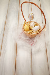 Basket with eggs on picnic table