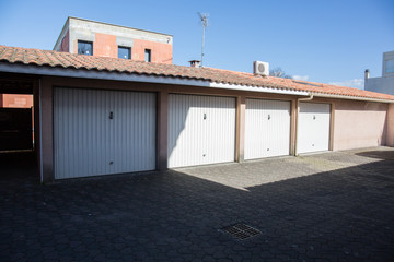 Garage building made of concrete with roller shutter doors