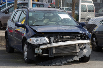 A blue wrecked car