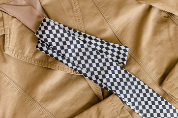 brown fashion jacket with black and white  necktie