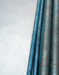 Metal hairpins on the scratched metal background.