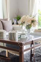 flower in glass vase on table in living room