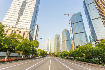Obraz premium skyline,urban road and office building at daytime.