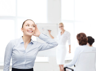 smiling businesswoman listening gossig