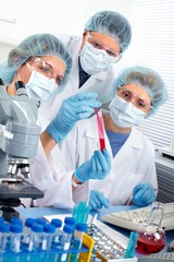 Group of medical doctors in laboratory.