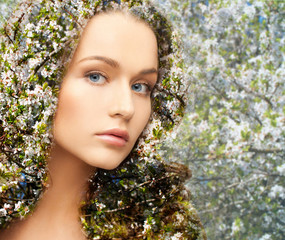 young woman over blooming tree pattern