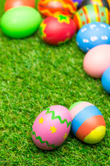 Fototapeta na wymiar Easter eggs on green grass