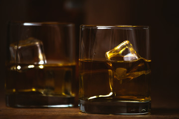 shot of whiskey on old wooden surface