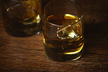 shot of whiskey on old wooden surface