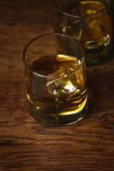 shot of whiskey on old wooden surface