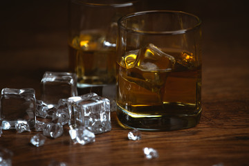 shot of whiskey on old wooden surface