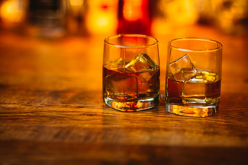 Whiskey drinks on wood