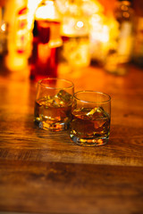 Whiskey drinks on wood