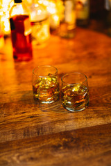 Whiskey drinks on wood