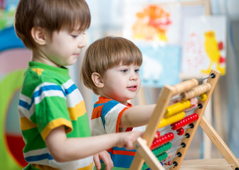 kids playing with abacus