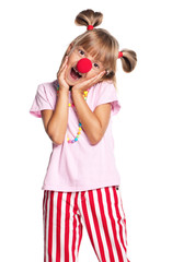 Little girl with clown nose