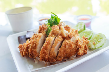 fried chicken with oil rice and spicy sauce