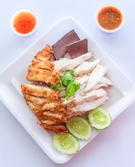 fried and stream chicken with oil rice and spicy sauce