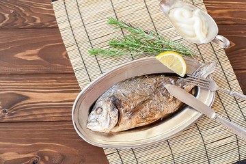 Fried dorado on the plate
