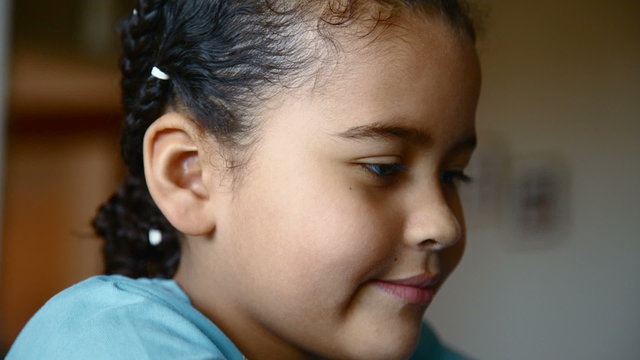 Happy young girl at home smiling in camera