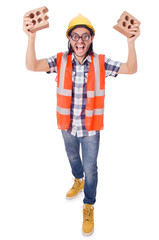 Funny young construction worker with broken brick isolated on