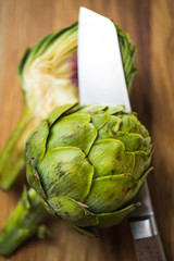 Obraz premium fresh artichokes on wooden background
