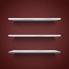 Empty white shelves on the dark  wall