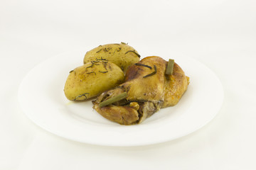 Rabbit stew and baked potatoes with rosemary