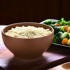 Cooked white quinoa seeds in bowl