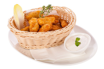 Crumbed chicken nuggets in a basket