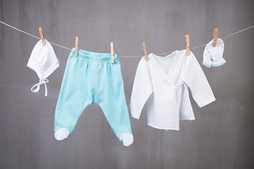 Baby clothes hanging on the clothesline.