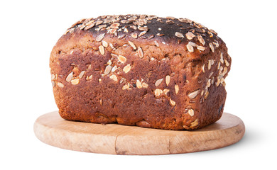 Unleavened bread with seeds on wooden board