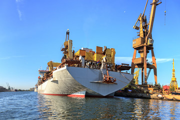 A big ship loading cargo at port of Gdansk, Poland.