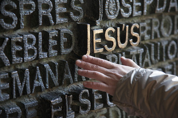 human hand and the word of Jesus