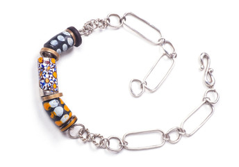 Close up of silver and painted stone necklace