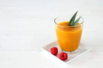 Raspberry, fruity mango smoothie made from ripe fruit
