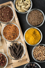 Various spices in small bowls