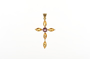 Golden Cross with gemstone jewel on white background