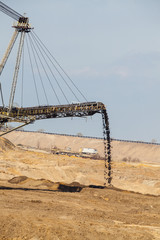 Obraz premium Opencast brown coal mine. Giant excavator.