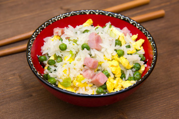 Cantonese rice on wooden table seen close