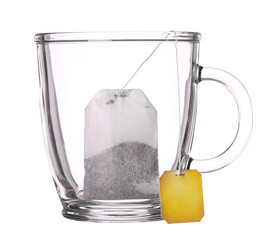 empty glass cup of tea with tea bag isolated on white background