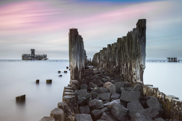 Old wooden pier and ruins of torpedo factory in Gdynia, Poland