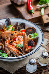 Tasty seafood soup with langoustines and mussels