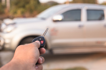 Hand holding car key
