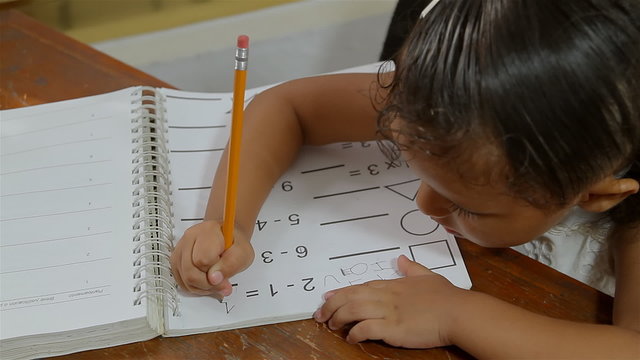 Hispanic Girl With Math Homework