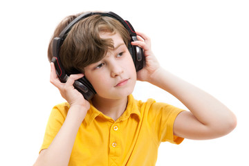 Child with headphones in yellow t-shirt, on white