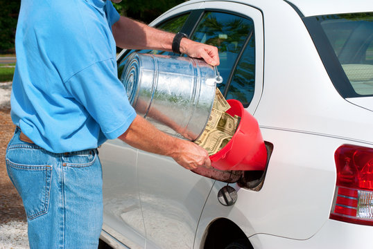 High Gas Prices - Pouring Money Into Gas Tank