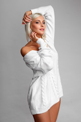 portrait of sexy woman in sweater and panties